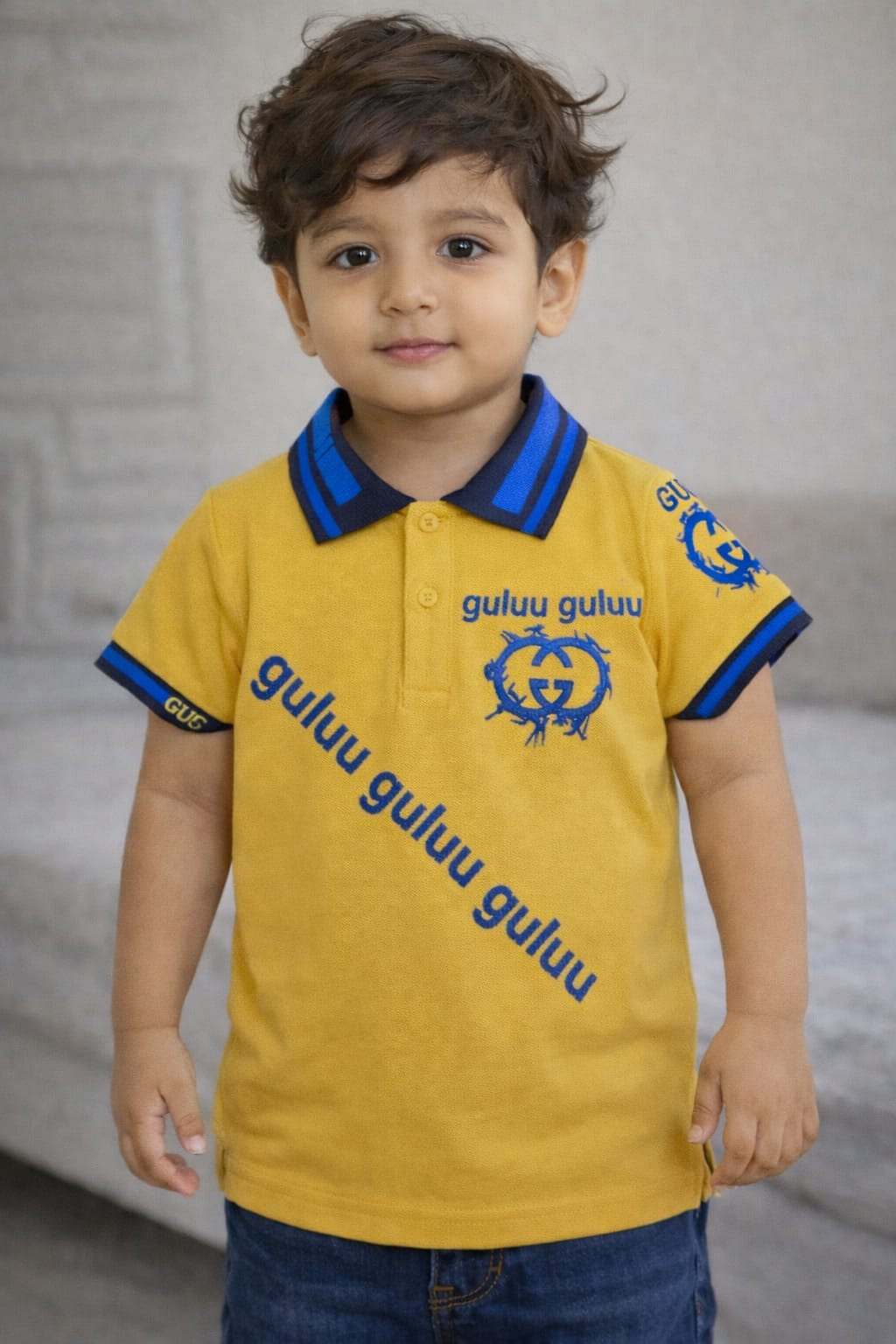 Stylish boys' polo T-shirt by Ory Moon, shown in a vibrant color, designed for kids aged 2 to 16 years.