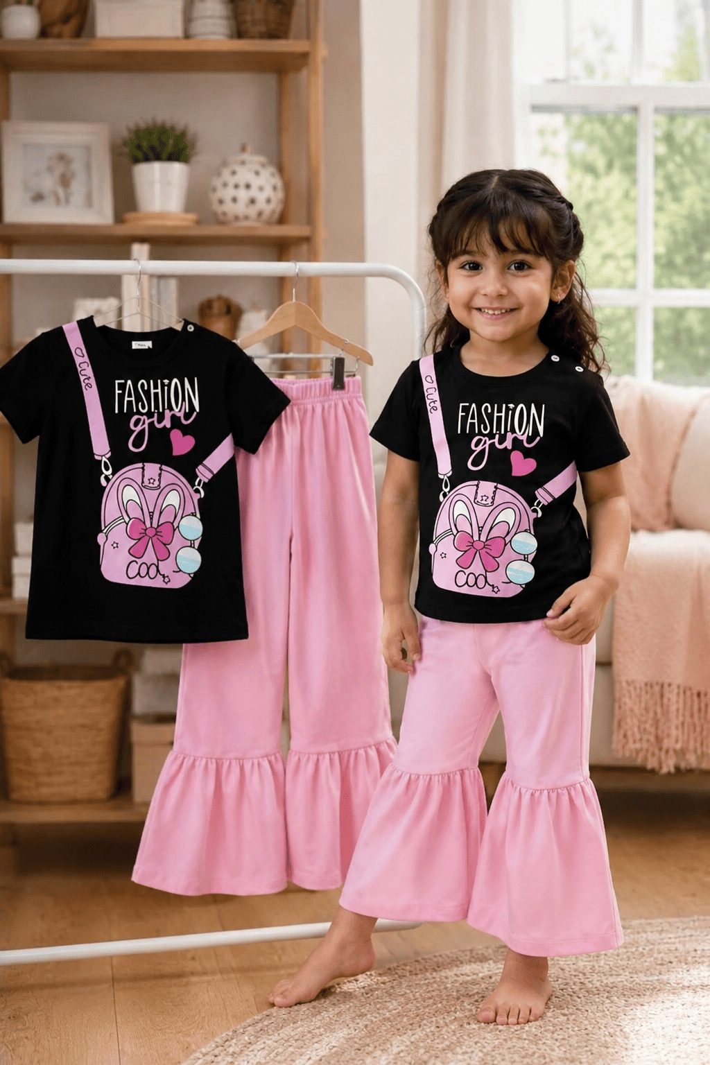 Girls' printed soft top and pants set in pink and white for ages 3 to 12, by Ory Moon, featuring a comfortable, stylish design.